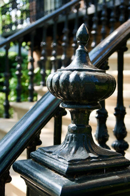 a wrought iron balustree with a circular top