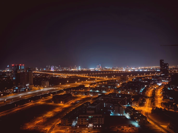 an aerial view of a city with the lights turned on