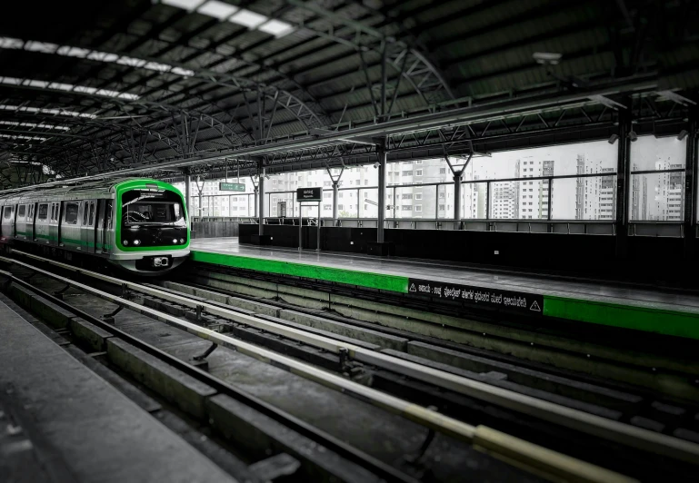 an elevated train pulling into the station where there are passengers