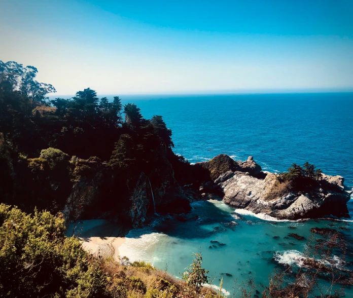 there is a view of the ocean from the top of a hill