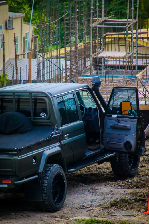 a jeep is parked next to a construction site
