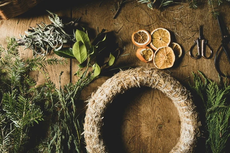 a bunch of fresh herbs, with a ring of dried fruits in the middle