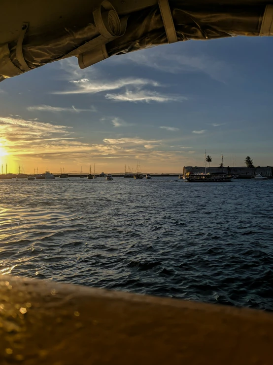 the view from inside a boat overlooking the water and a pier