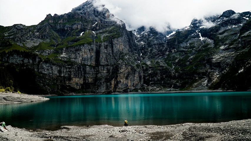 a lake that has mountains in the background