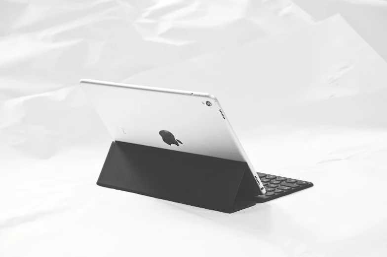 there is a laptop that has a black keyboard on it