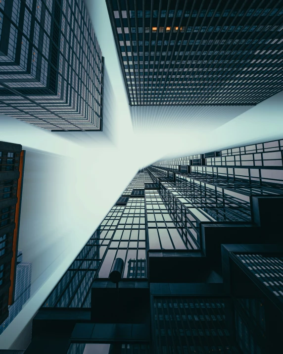 a group of windows that are reflecting the sky