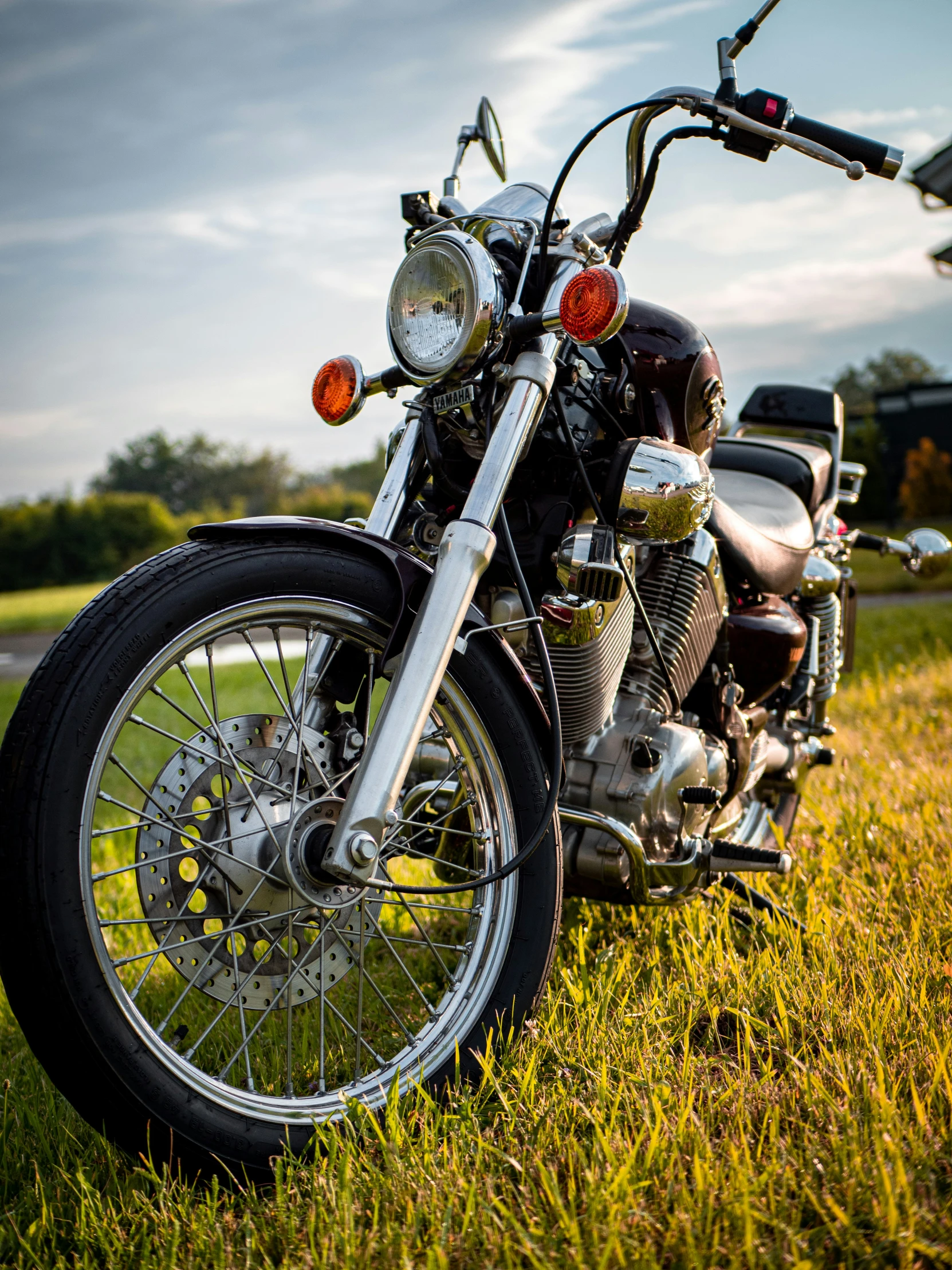 a motorcycle parked in the middle of a field