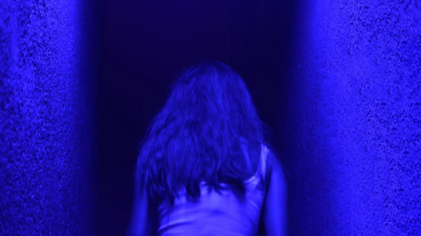 there is a woman in a blue light