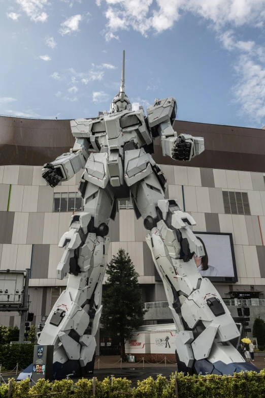 an odd looking statue is standing out front of the building