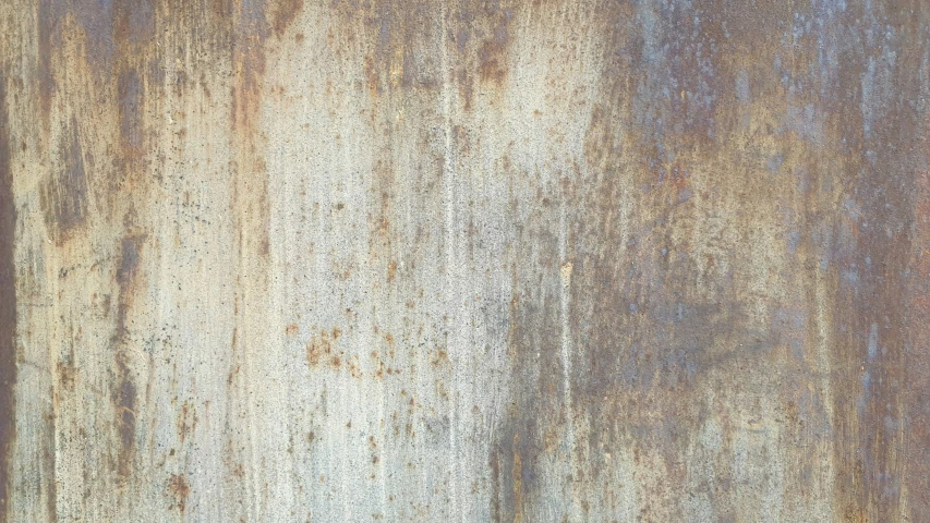 an old rusted metal surface with the colors of blue and white