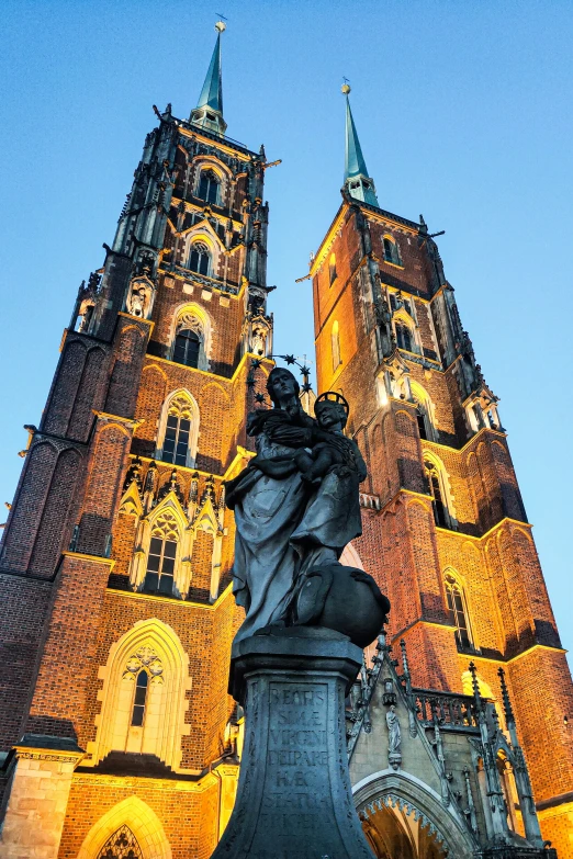 the cathedral at dusk with lights shining on it