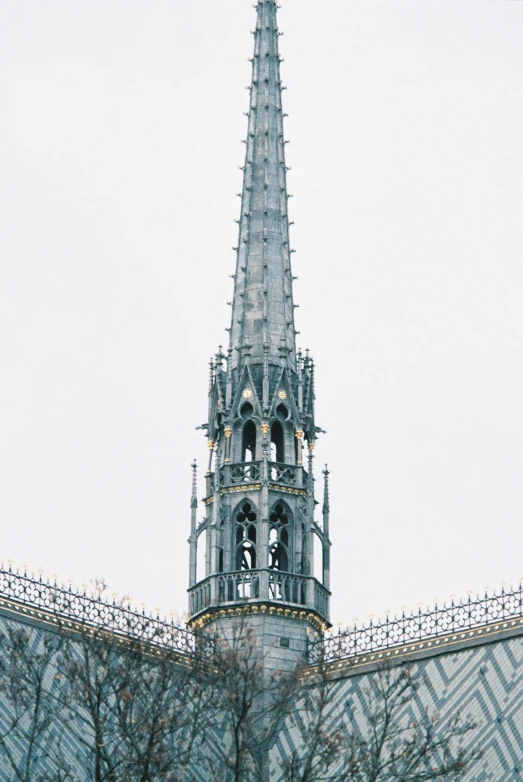 an ornate building with a spire sticking out