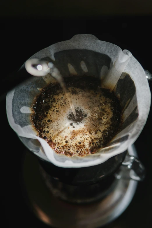 the inside of a strainer is filled with coffee