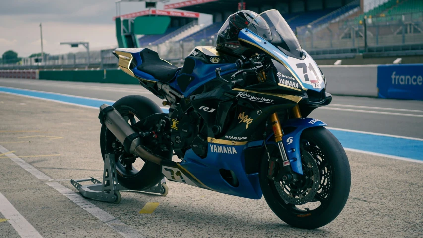 a motor bike sitting on top of a race track