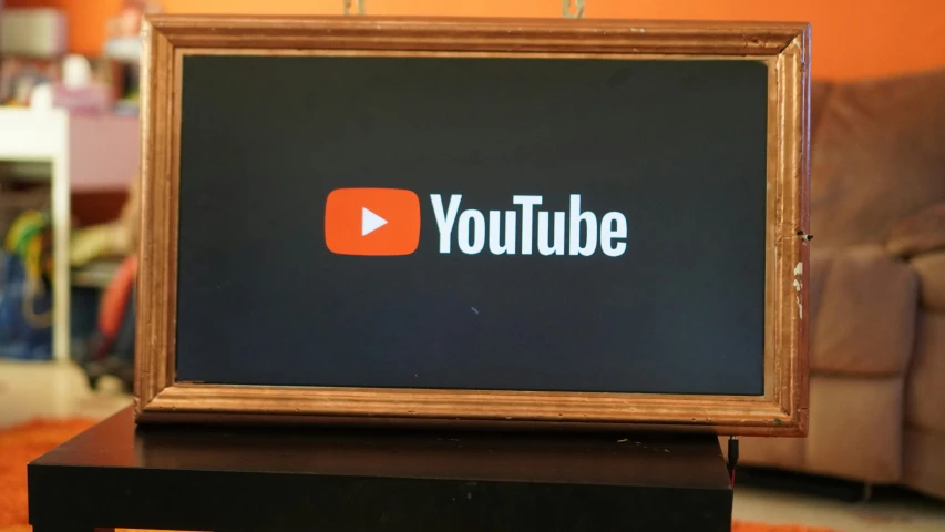 a youtube sign is displayed on top of a table