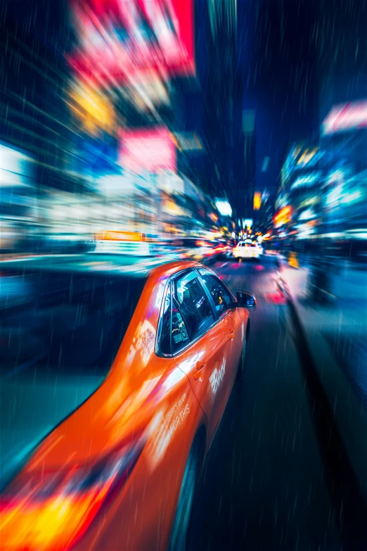 a car driving down the road at night time