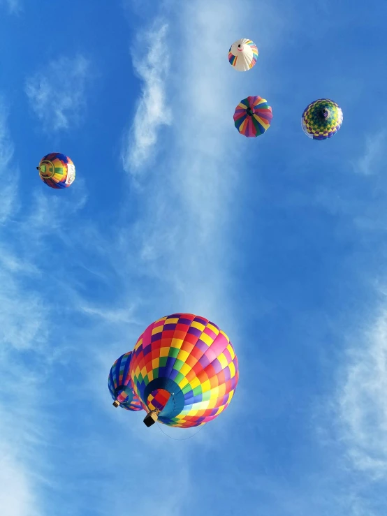 many  air balloons floating in the blue sky