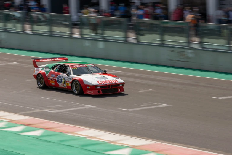 the racing car is driving along the track