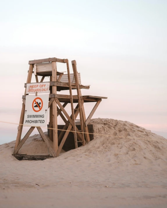 a life guard tower sitting on the beach