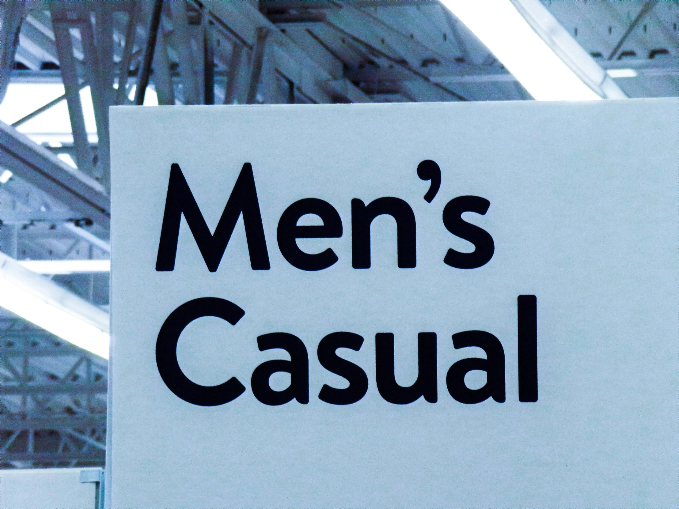 sign advertising a casual clothing store, men's casual