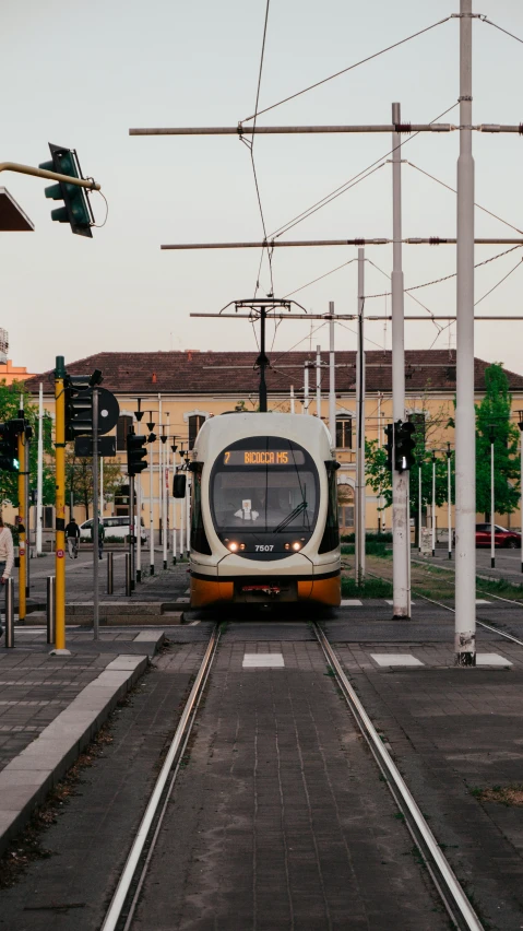 a train moving down the tracks during the day