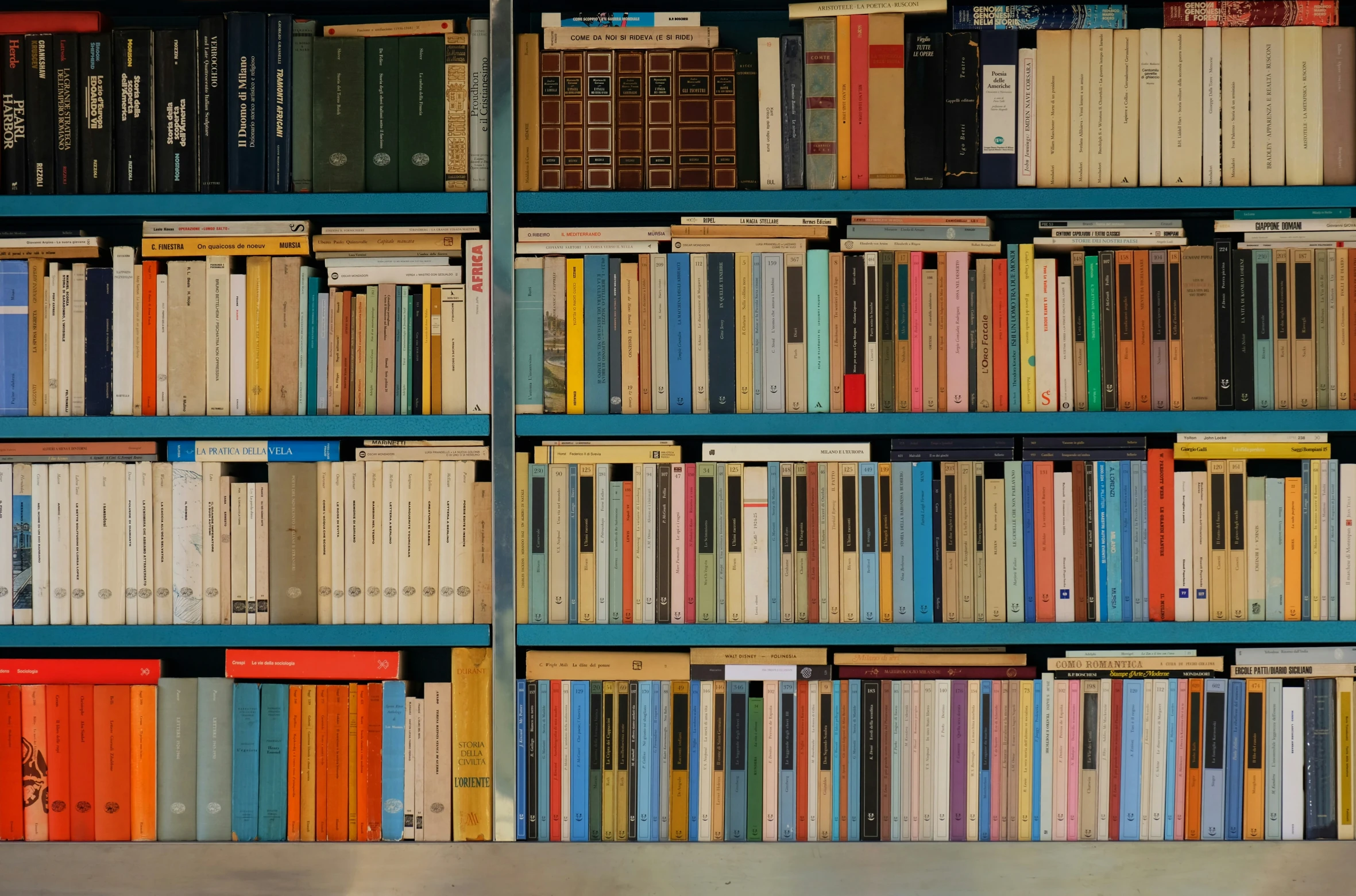 a group of books stacked up in a room