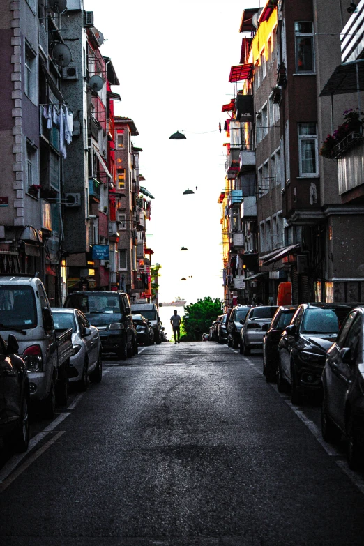 the street is very busy with cars and buildings