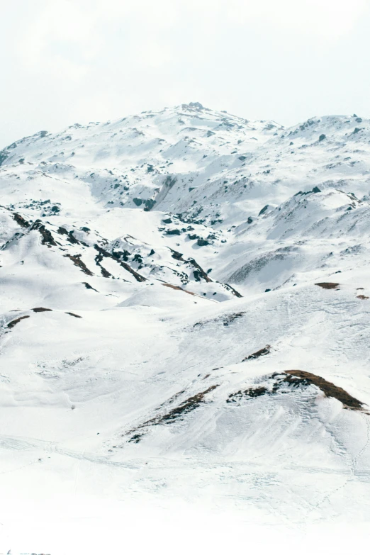 a group of people snow skiing on a hill