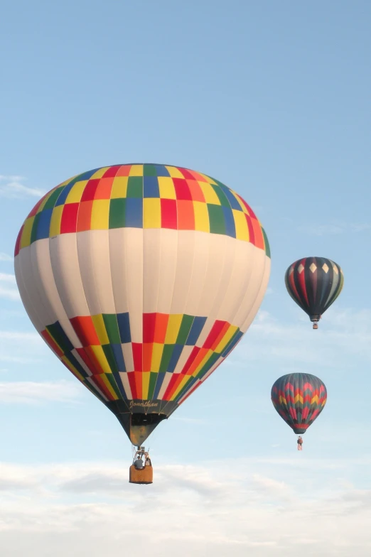 the colorful balloons have been lifted into the air