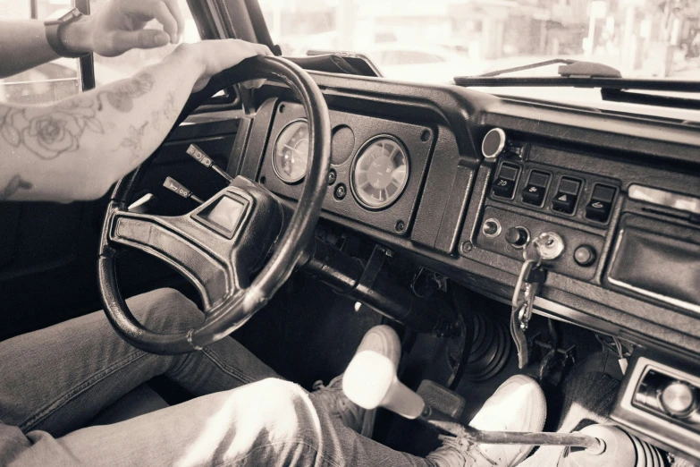 the interior of an old fashioned car in black and white