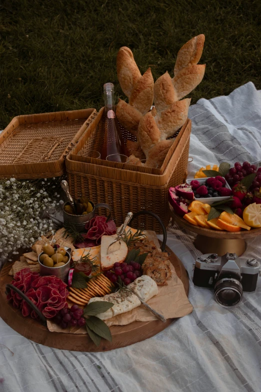 two wicker basket with wine and sweets on top