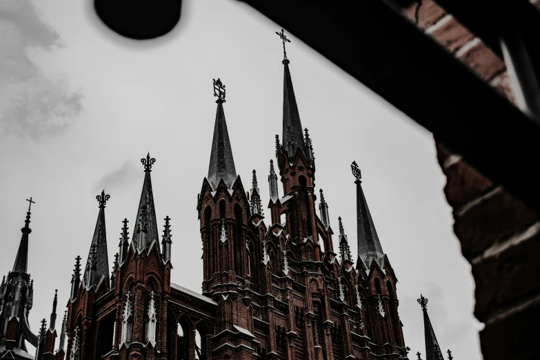 the top of a large tower with steeples