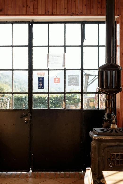 a tall fire hydrant sitting in front of a door