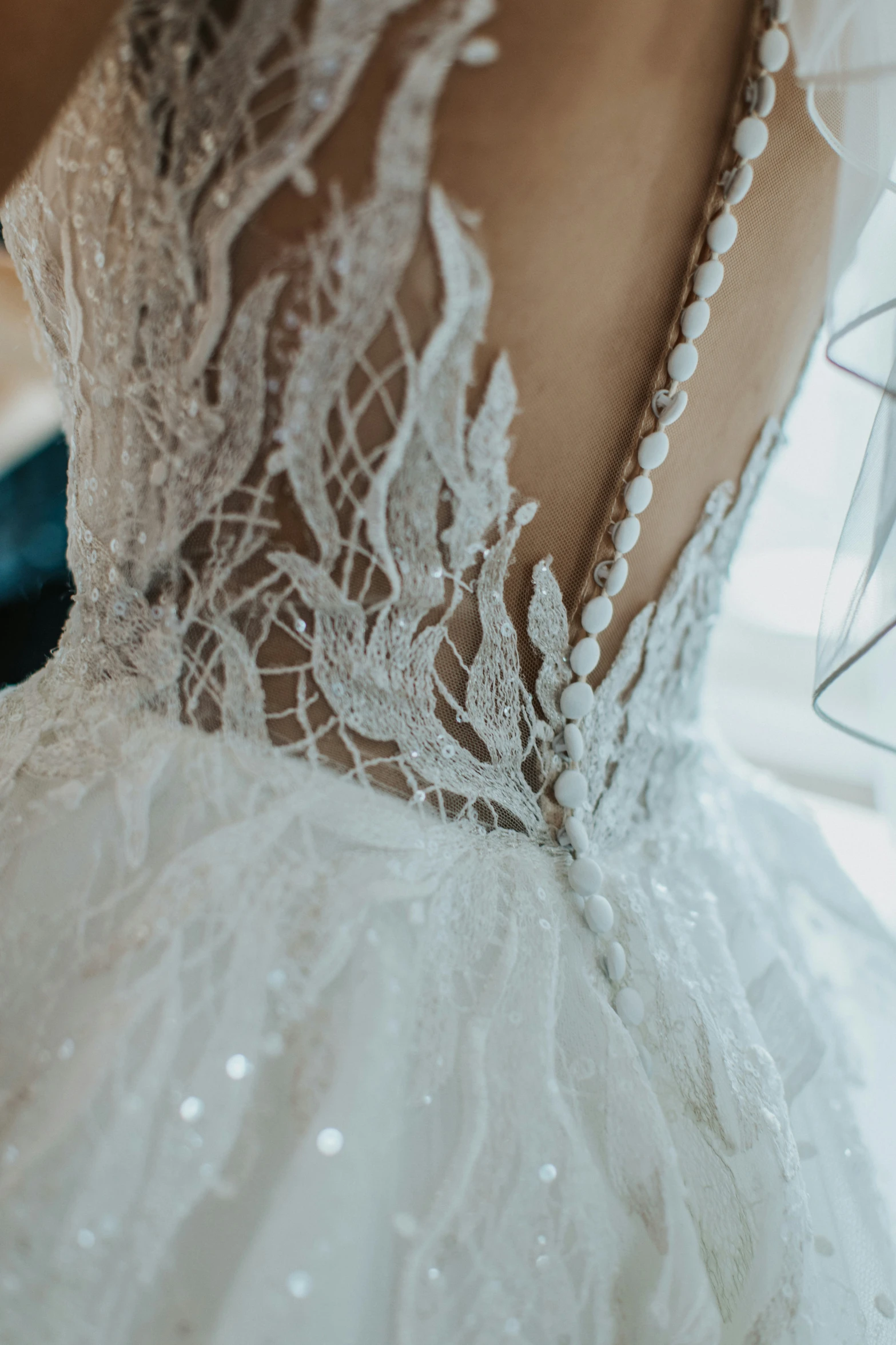 the back view of a wedding gown in a bridal