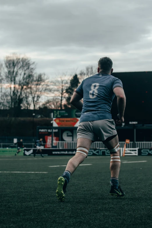 there is a man that is playing frisbee on the field