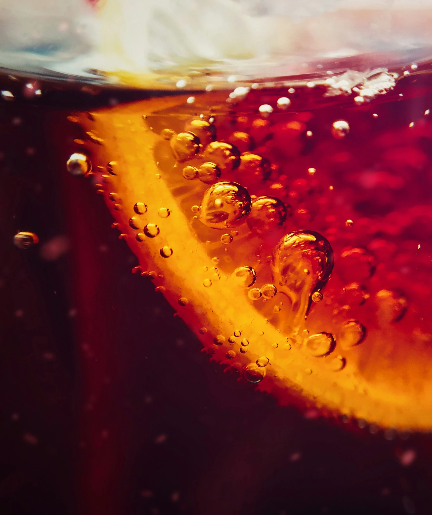 water drops on an orange slice in a glass