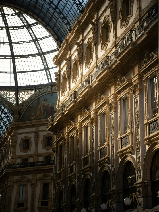 an interior view of a building with glass roof and curved walls