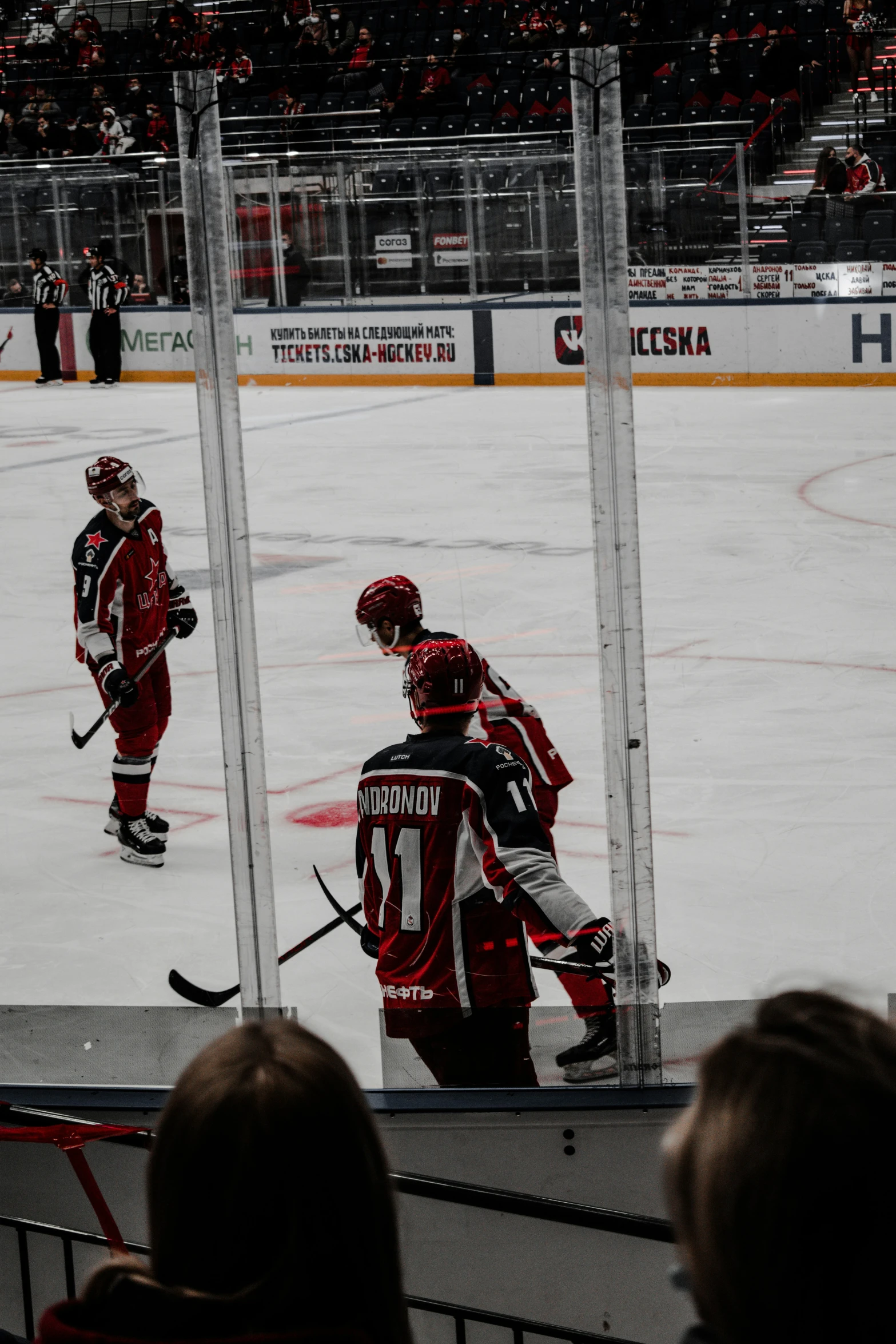 a hockey game in progress with the goaltender and players