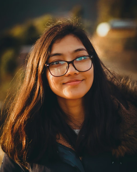 woman wearing glasses while looking to the side