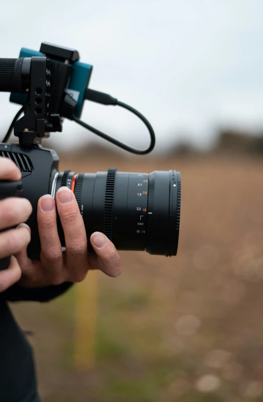 the camera's lens is pointed toward the ground