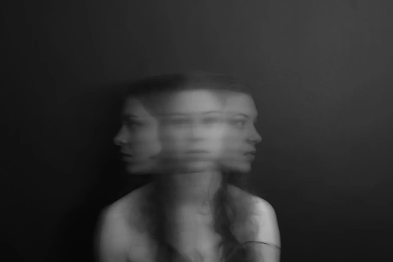 a blurry image of a young woman