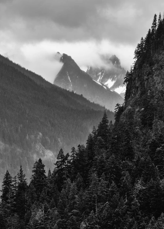 the mountain is covered in a heavy layer of snow