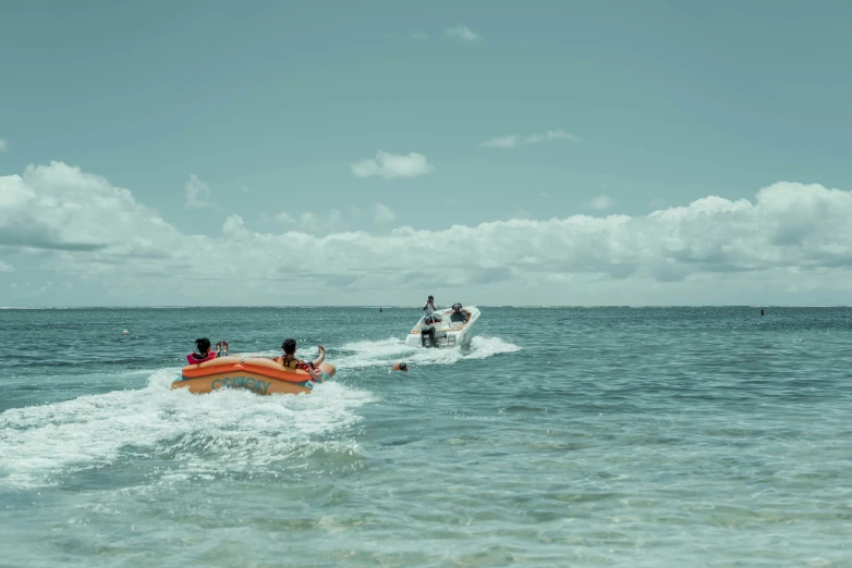 the people are riding their skis in the water