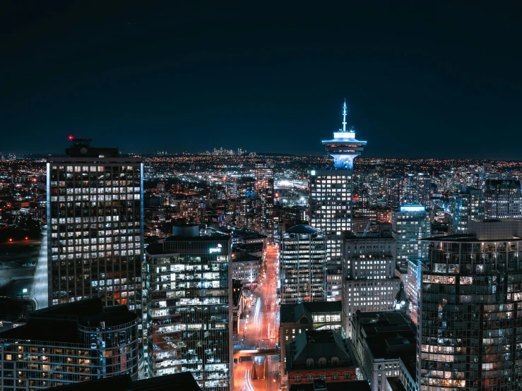 city skyline at night looking toward a large skyscr