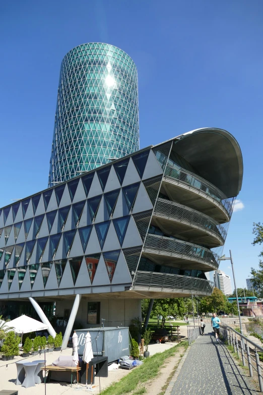 an unusual building stands in front of a paved street