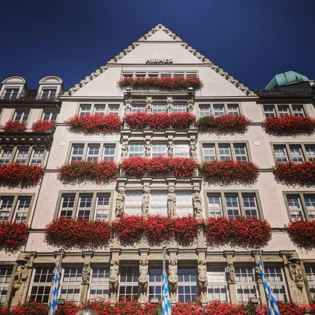 beautiful balcony on the top floor with windows and flowers in blooming