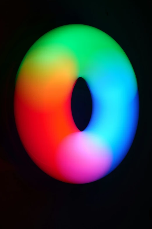 a close up of a circular object with a black background