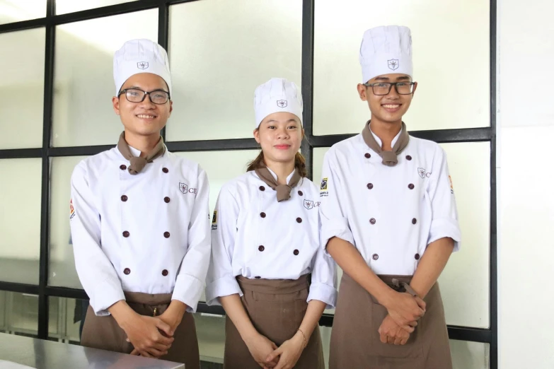 a group of chefs that are standing near each other