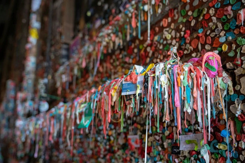 the wall covered with colorful hearts and lots of ribbon