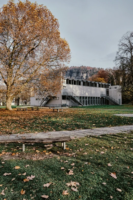 an image of a building and trees in a field